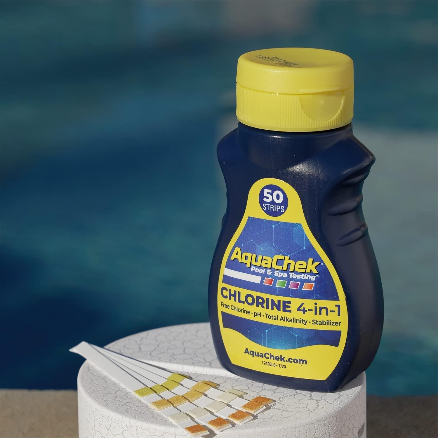 AquaChek pool testing strips bottle with test strips on a poolside background