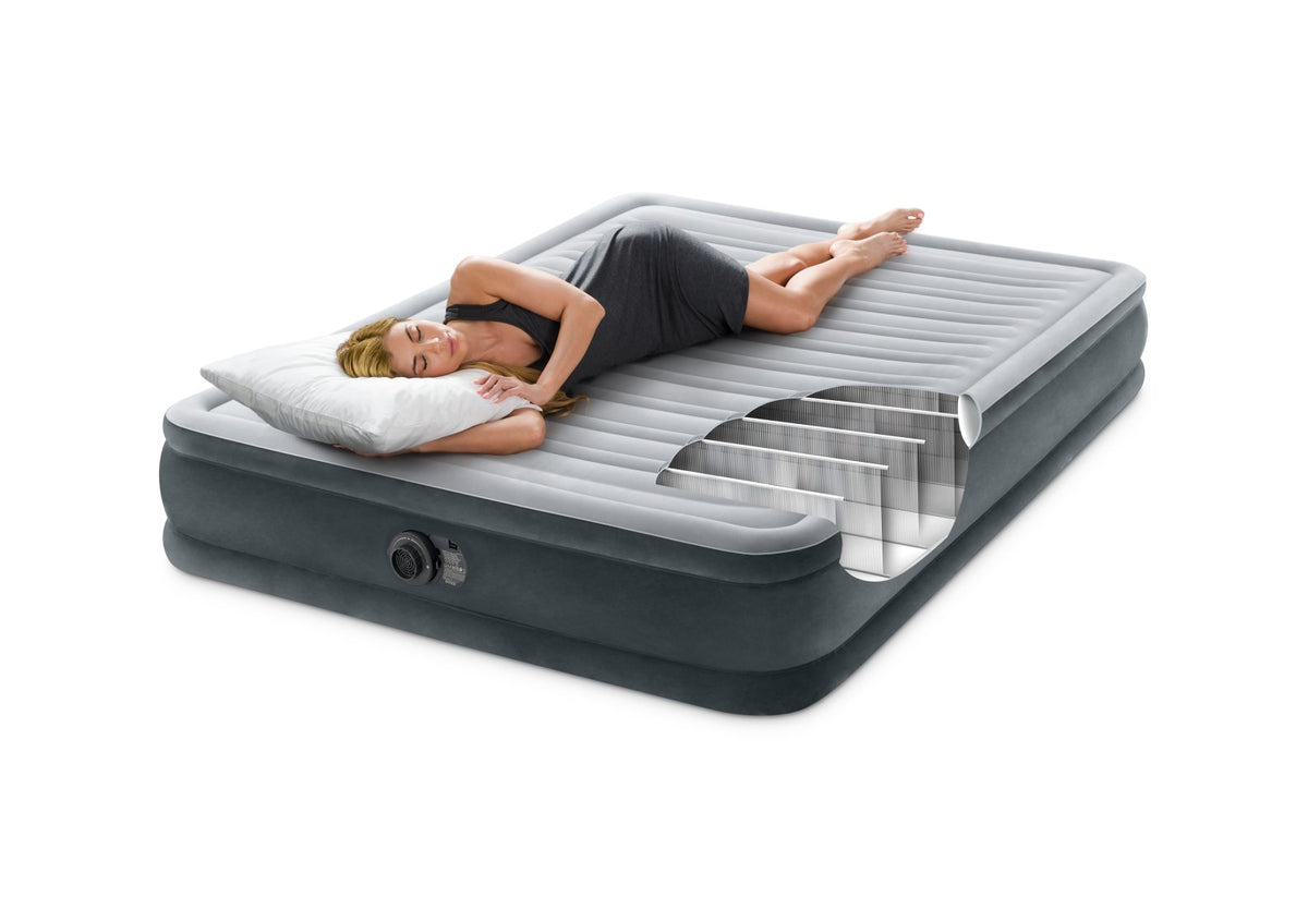 Inflatable air mattress with a person lying on it on a white background