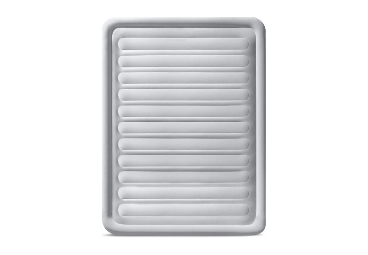 A rectangular white inflatable mattress or sleeping pad with horizontal ribbed channels and rounded corners, shown on a plain white background.