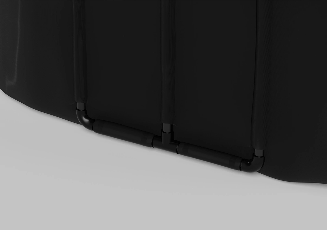 Close-up detail of a black curved panel structure with horizontal support bars against a light gray background.