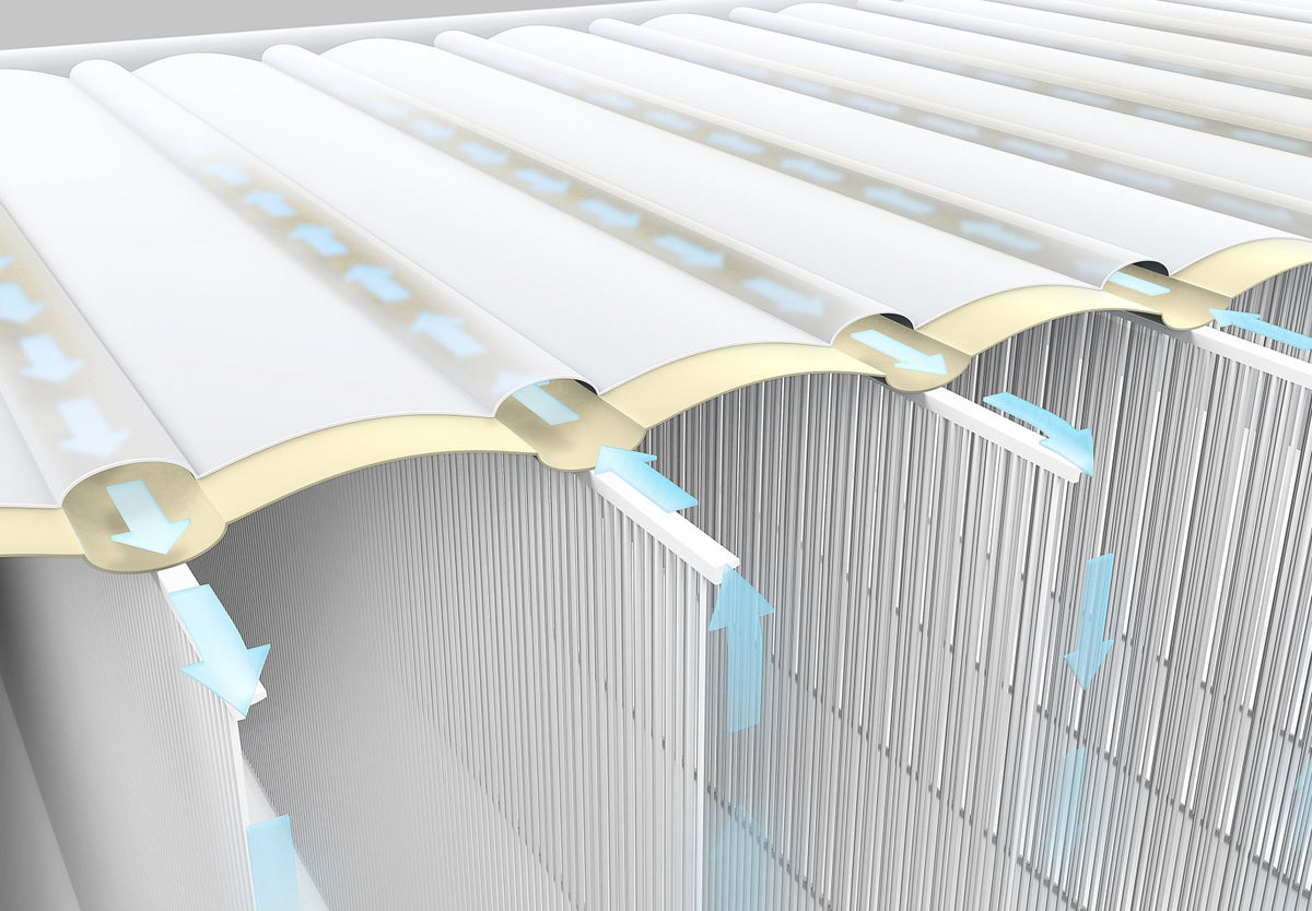 Close-up of a metallic structure with gold accents on a gray background