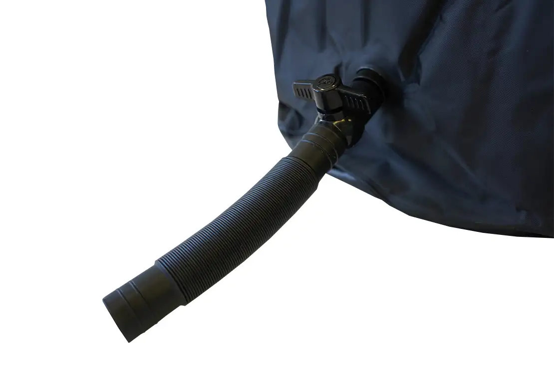 Close-up of a black flexible drainage hose connected to a dark blue or navy outdoor cover or tarp, shown against a plain white background.