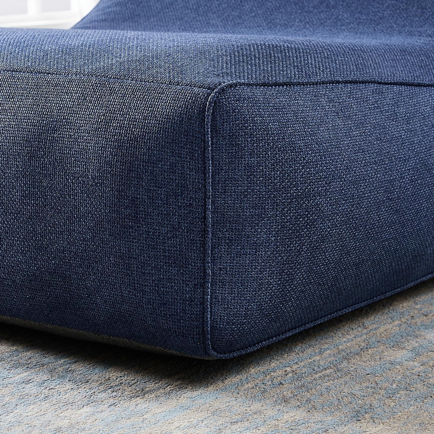 Close-up of a blue fabric surface with a textured pattern