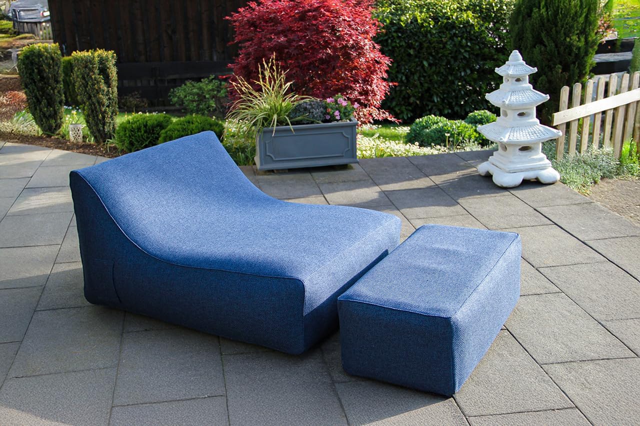 Blue outdoor lounge chair with ottoman on a patio
