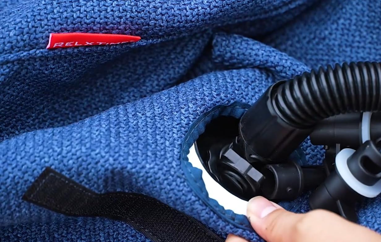 Close-up of a blue textured surface with a black hose and RELX logo.