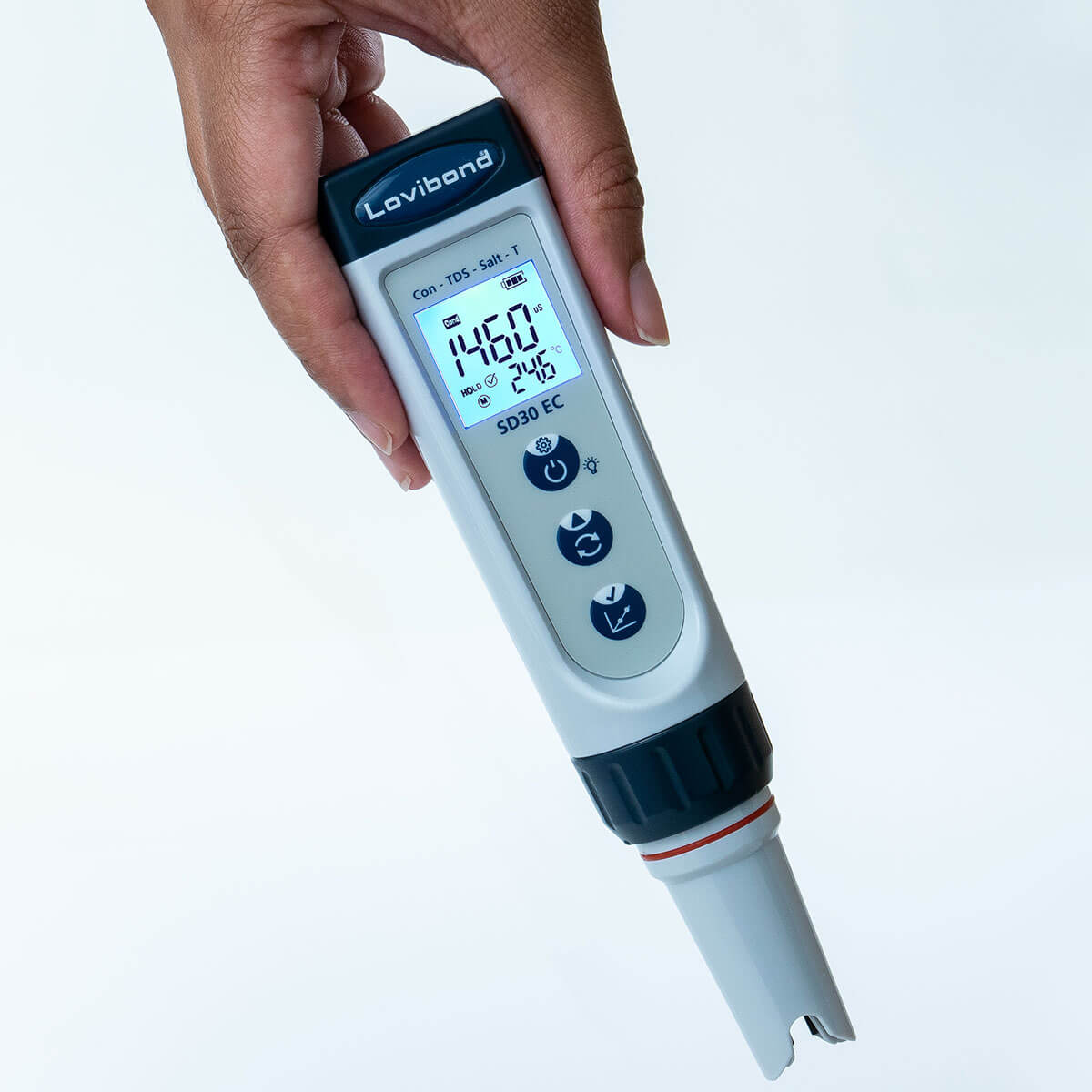Digital Salt/TDS meter held by a hand with a white background