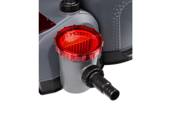 Close-up of a gray and black water filter component with a translucent red strainer basket and black hose connector, shown against a dark background.