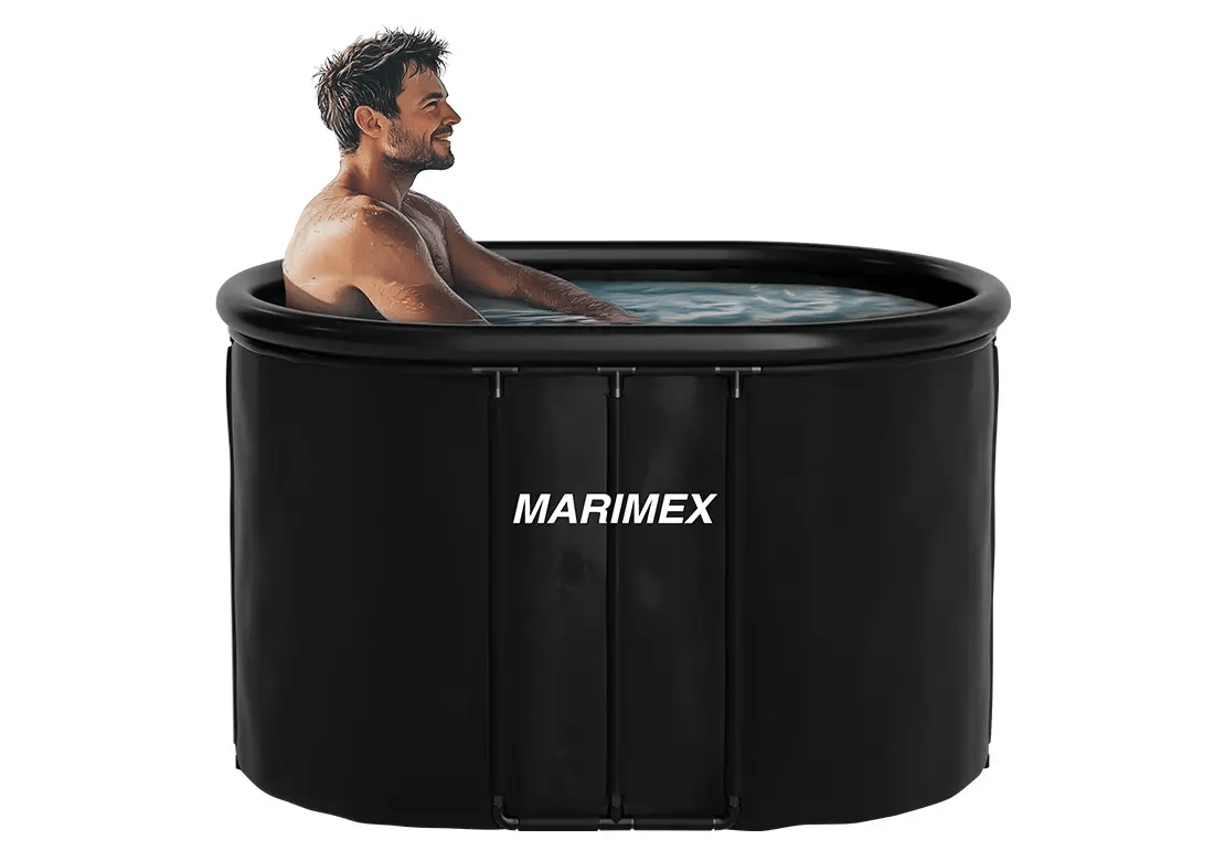 Man sitting in a black inflatable ice bath labeled 'Marimex' on a white background