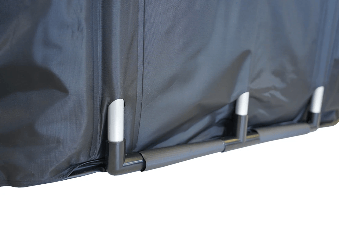 Close-up of a dark gray waterproof tent fabric with a black and gray frame corner and white plastic tip connectors, shown against a plain white background.