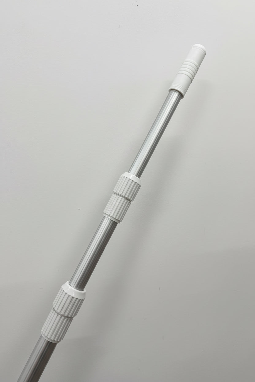 A silver telescopic metal pole with white plastic adjustment collars and a white ribbed cap, shown diagonally against a plain light gray background.
