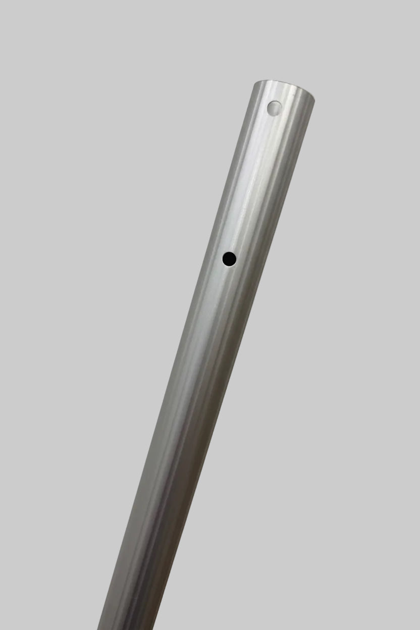 A close-up of a silver aluminum rod with pre-drilled holes, shown against a plain light gray background.